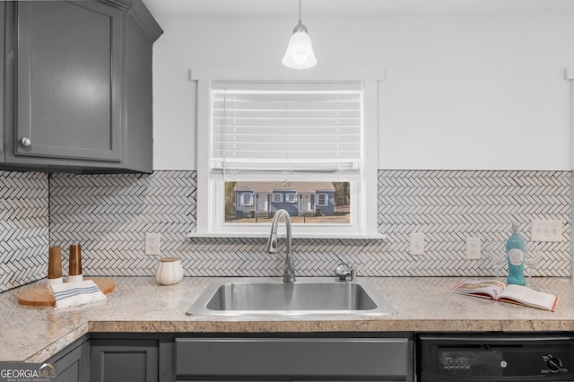 kitchen with gray cabinets, black dishwasher, sink, and decorative light fixtures