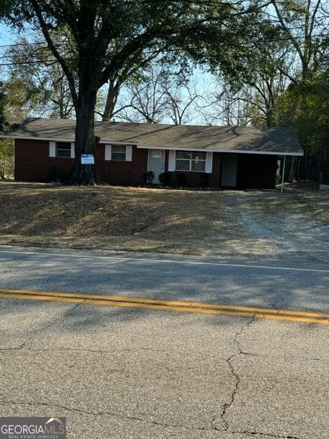 ranch-style house with a carport