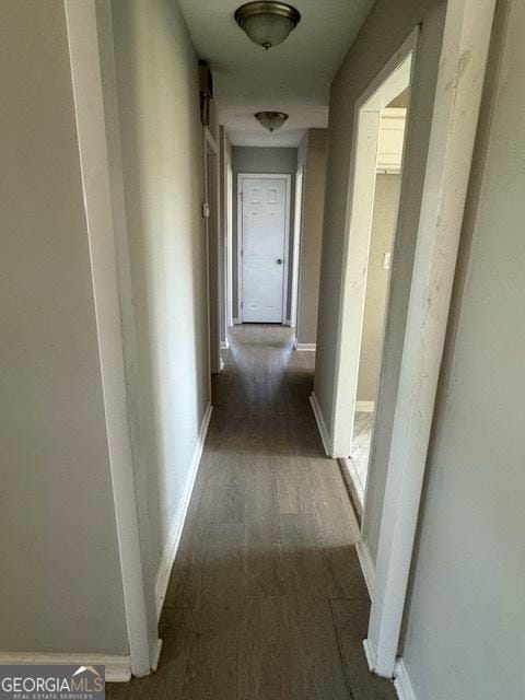 hall with dark hardwood / wood-style floors