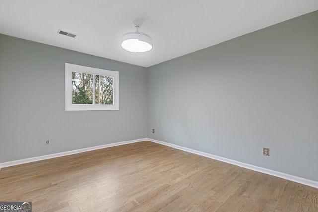 spare room with light wood-type flooring