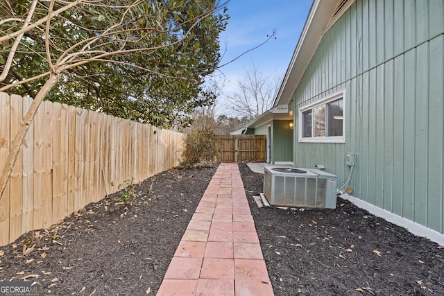 view of yard with central AC unit