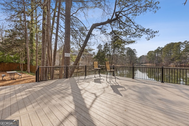 wooden deck featuring a water view