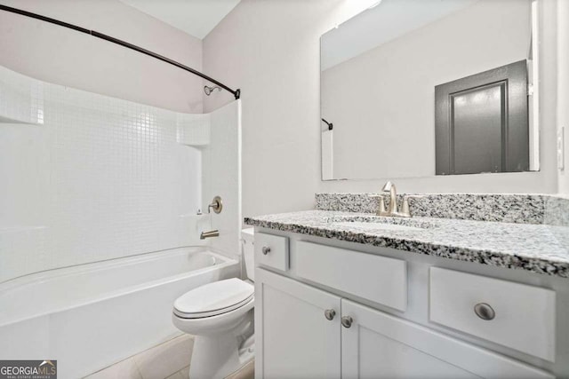 bathroom with shower / washtub combination, tile patterned flooring, vanity, and toilet