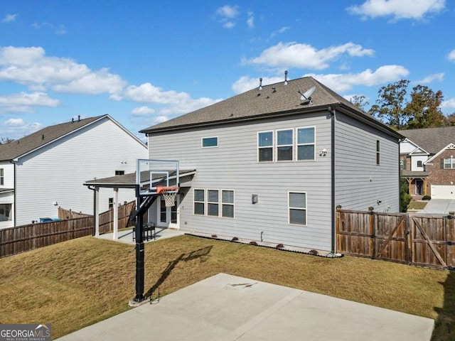 rear view of house featuring a yard, a fenced backyard, a gate, and a patio