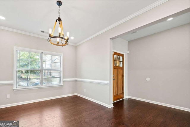 unfurnished dining area featuring dark wood-type flooring, visible vents, ornamental molding, and baseboards