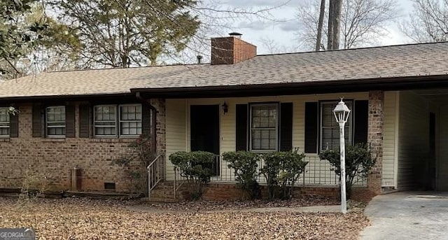 ranch-style house with covered porch