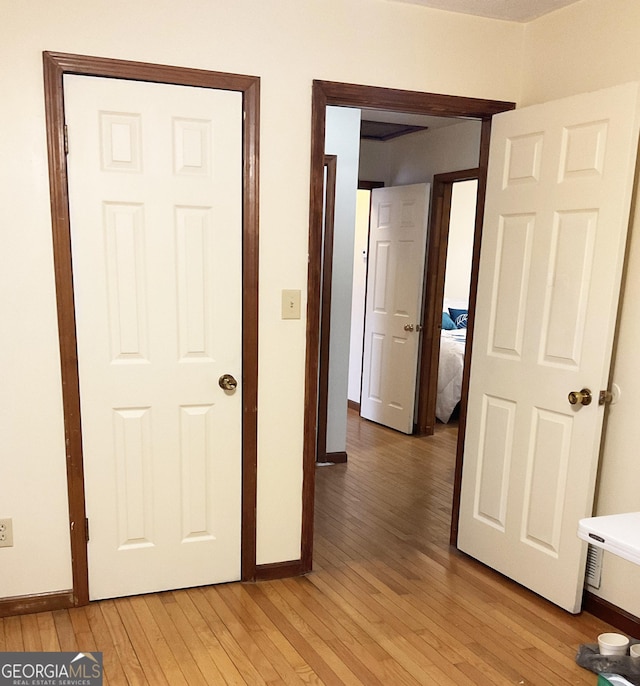 hallway featuring light hardwood / wood-style flooring