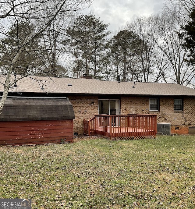 back of house with a yard and a deck