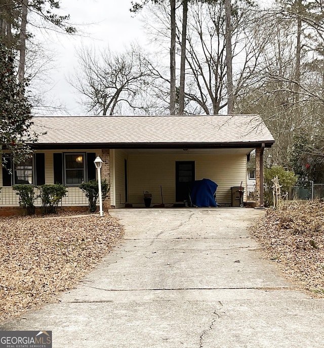 exterior space with a carport