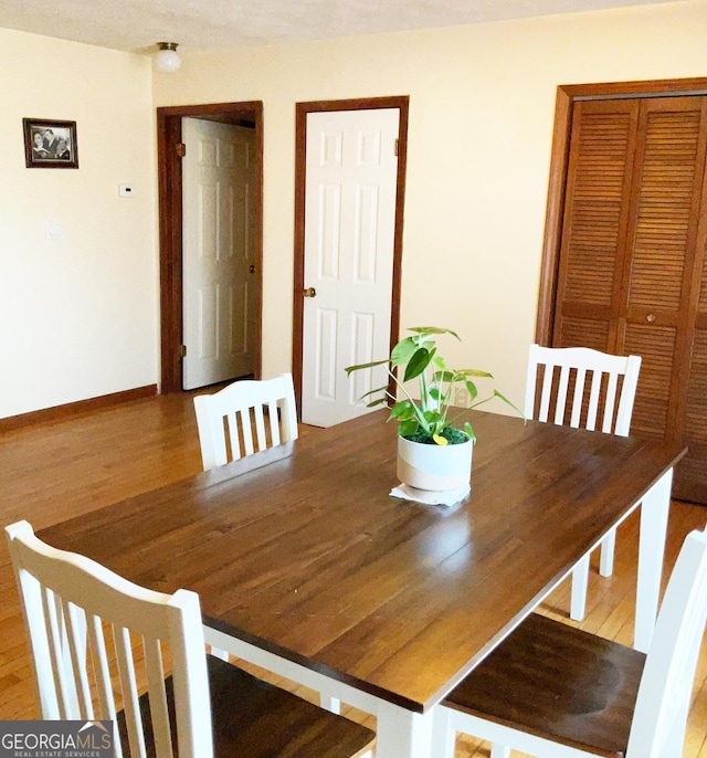 unfurnished dining area with hardwood / wood-style flooring