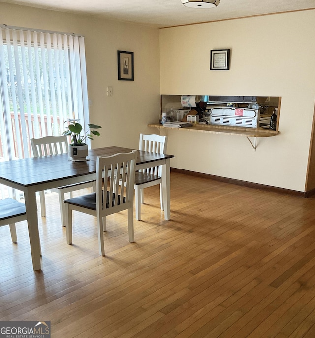 dining room with hardwood / wood-style flooring