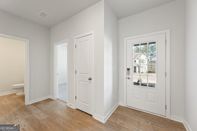 foyer with light wood-type flooring