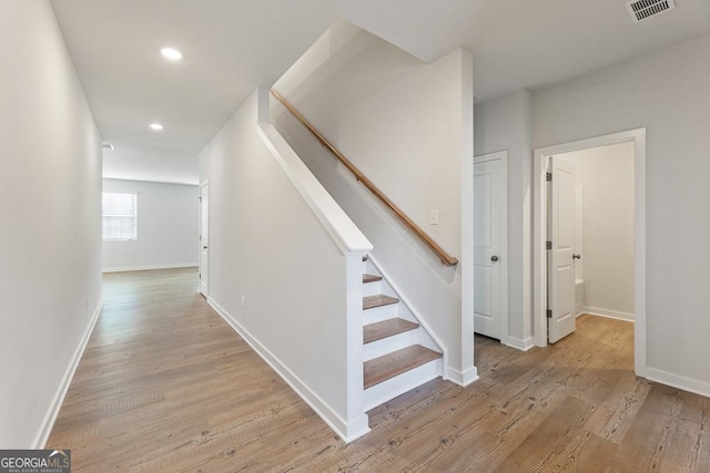 hall with light hardwood / wood-style flooring