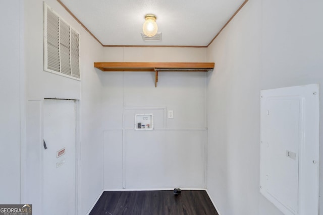 clothes washing area with dark hardwood / wood-style flooring, hookup for a washing machine, and ornamental molding