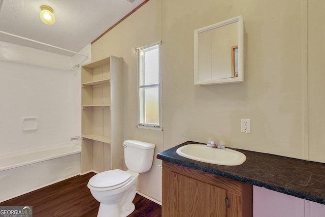 bathroom featuring hardwood / wood-style flooring, vanity, and toilet