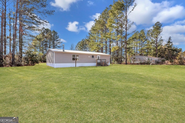 view of yard featuring a wooden deck