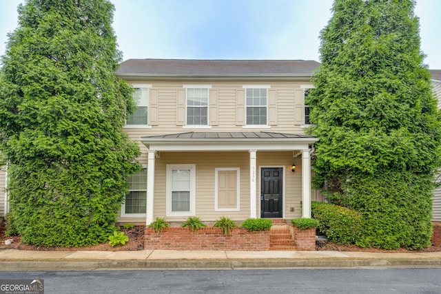 3236 Tallon Ln SW, Atlanta, GA 30311 - view of front of house with a standing seam roof, a metal roof, and brick siding
