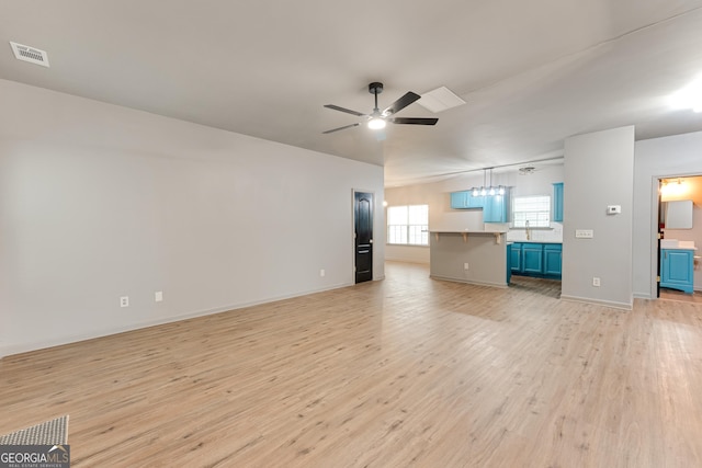 3236 Tallon Ln SW, Atlanta, GA 30311 - unfurnished living room with light wood-style flooring and a ceiling fan
