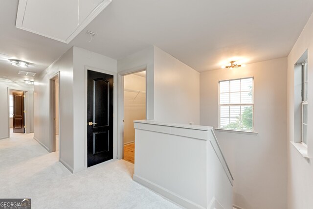 3236 Tallon Ln SW, Atlanta, GA 30311 - corridor featuring attic access, an upstairs landing, and light carpet