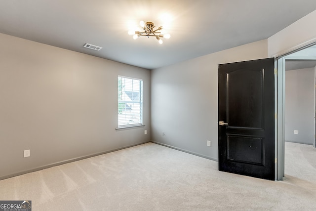 3236 Tallon Ln SW, Atlanta, GA 30311 - unfurnished bedroom with carpet flooring and a chandelier