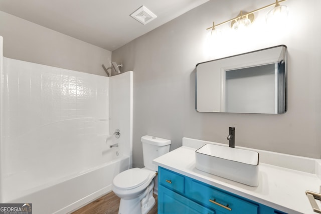 3236 Tallon Ln SW, Atlanta, GA 30311 - bathroom featuring vanity, shower / washtub combination, and wood finished floors