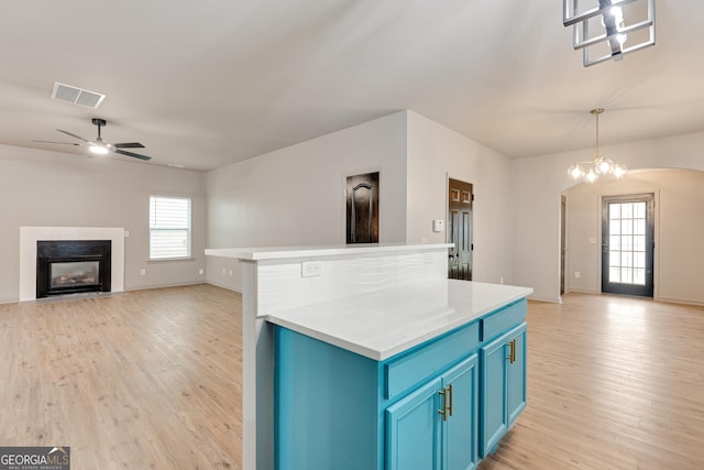 3236 Tallon Ln SW, Atlanta, GA 30311 - kitchen with blue cabinetry, open floor plan, light wood-style floors, and ceiling fan