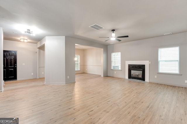 3236 Tallon Ln SW, Atlanta, GA 30311 - unfurnished living room featuring light wood-style flooring, ceiling fan, and a premium fireplace