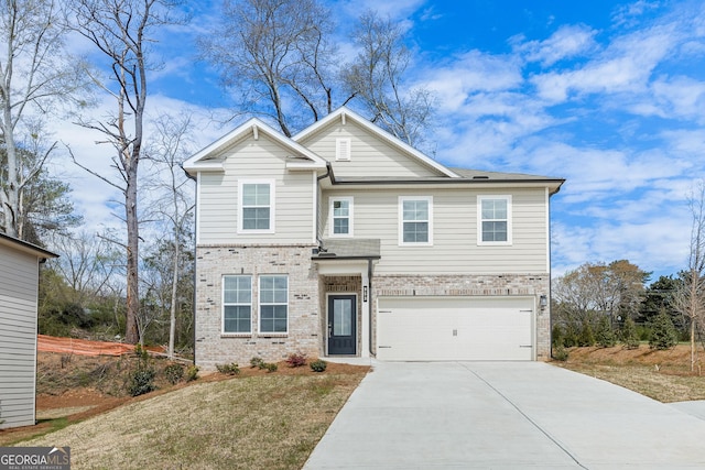 view of front of property featuring a garage and a front yard