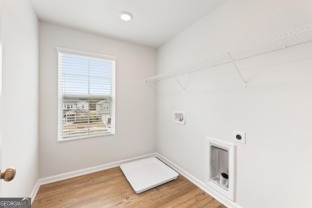 laundry area with washer hookup, hardwood / wood-style flooring, and electric dryer hookup