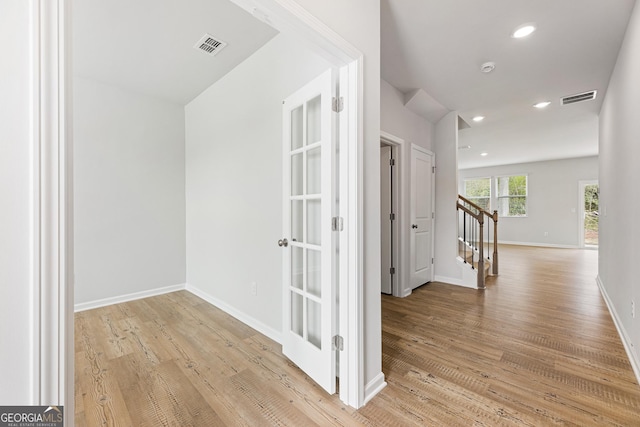 corridor featuring light wood-type flooring