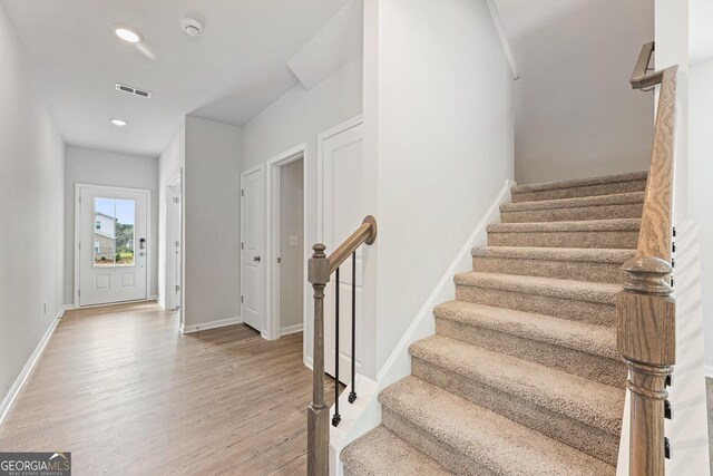 spare room with light hardwood / wood-style flooring