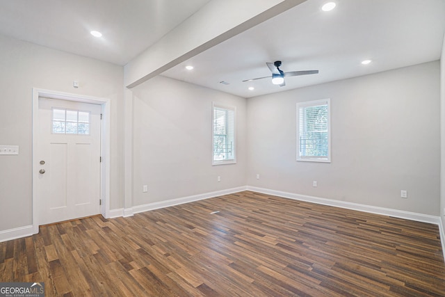 foyer entrance featuring dark wood-type flooring and ceiling fan