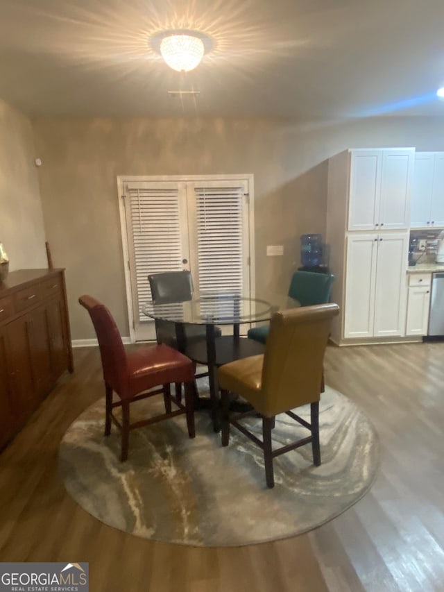 dining space featuring light hardwood / wood-style floors