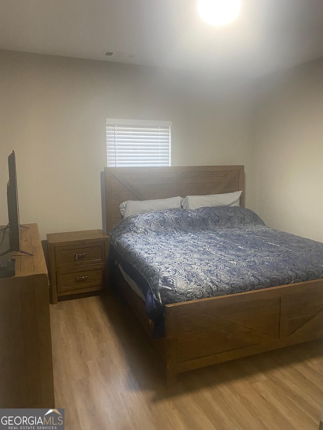 bedroom with light hardwood / wood-style floors