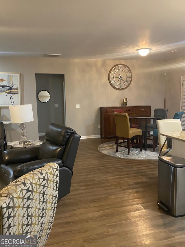 living room with dark hardwood / wood-style floors