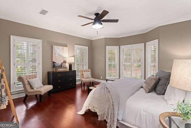 bedroom featuring crown molding, dark hardwood / wood-style floors, and ceiling fan