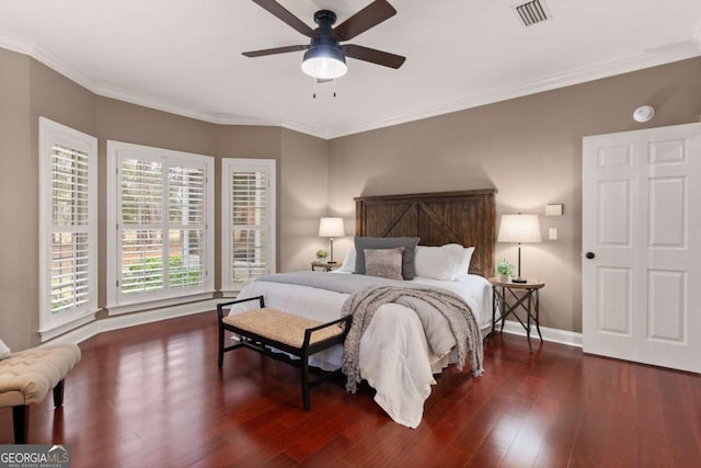 bedroom featuring crown molding, ceiling fan, and dark hardwood / wood-style floors