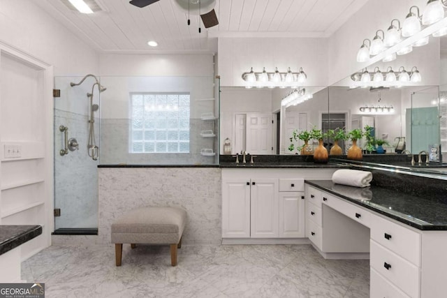 bathroom featuring wood ceiling, crown molding, ceiling fan, vanity, and a shower with shower door