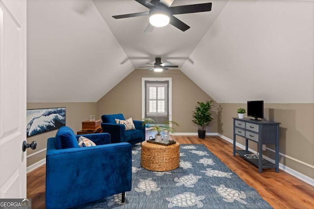 interior space with hardwood / wood-style flooring and vaulted ceiling