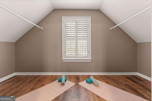 bonus room featuring wood-type flooring and lofted ceiling