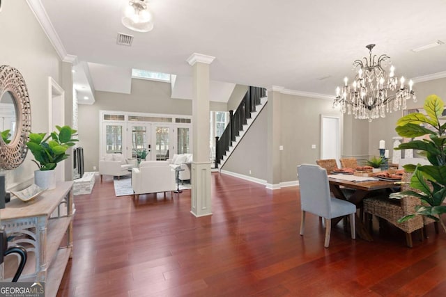 dining space featuring ornamental molding, dark wood-type flooring, and french doors