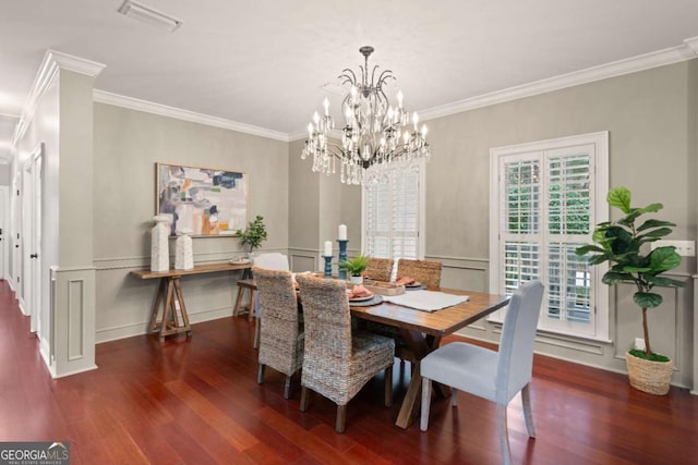 dining room featuring ornamental molding and dark hardwood / wood-style floors