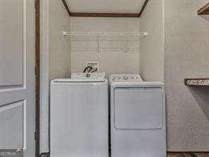 washroom featuring washer and clothes dryer