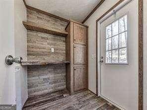 doorway to outside featuring dark hardwood / wood-style floors