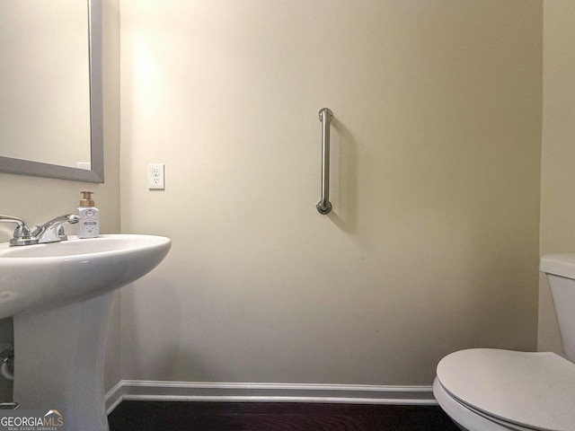 bathroom with sink and toilet