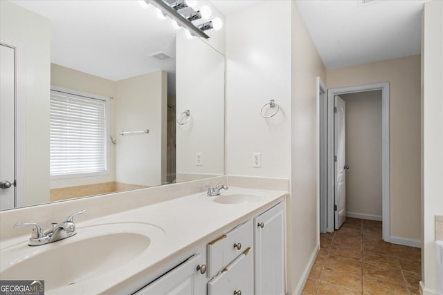 bathroom with vanity and tile patterned floors