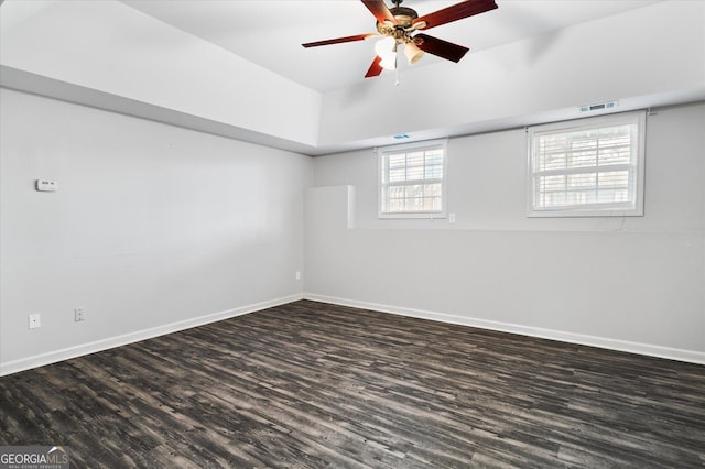 unfurnished room with dark wood-type flooring and ceiling fan