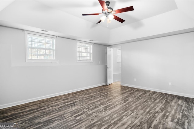 spare room with ceiling fan and dark hardwood / wood-style floors