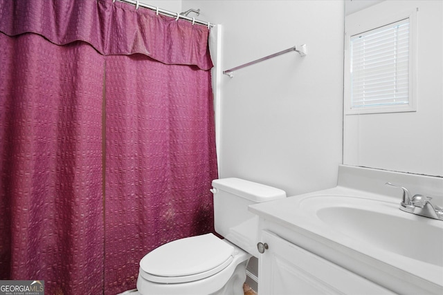 bathroom featuring vanity and toilet