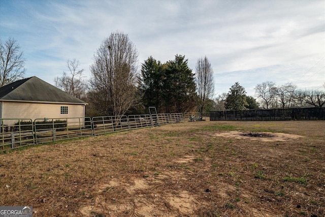 view of yard with a rural view